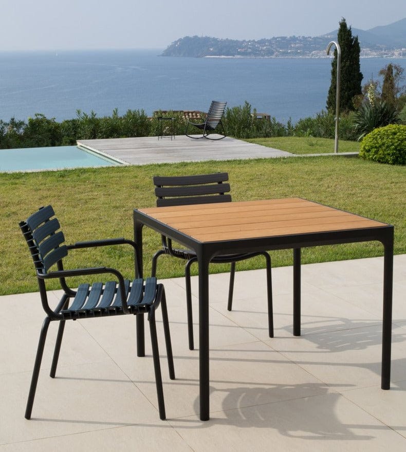 Black dining chairs with bamboo table outdoor
