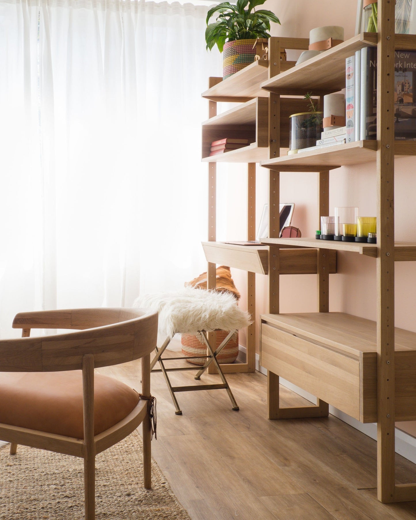 Coastal interior with wooden shelves, chair, and accessories.