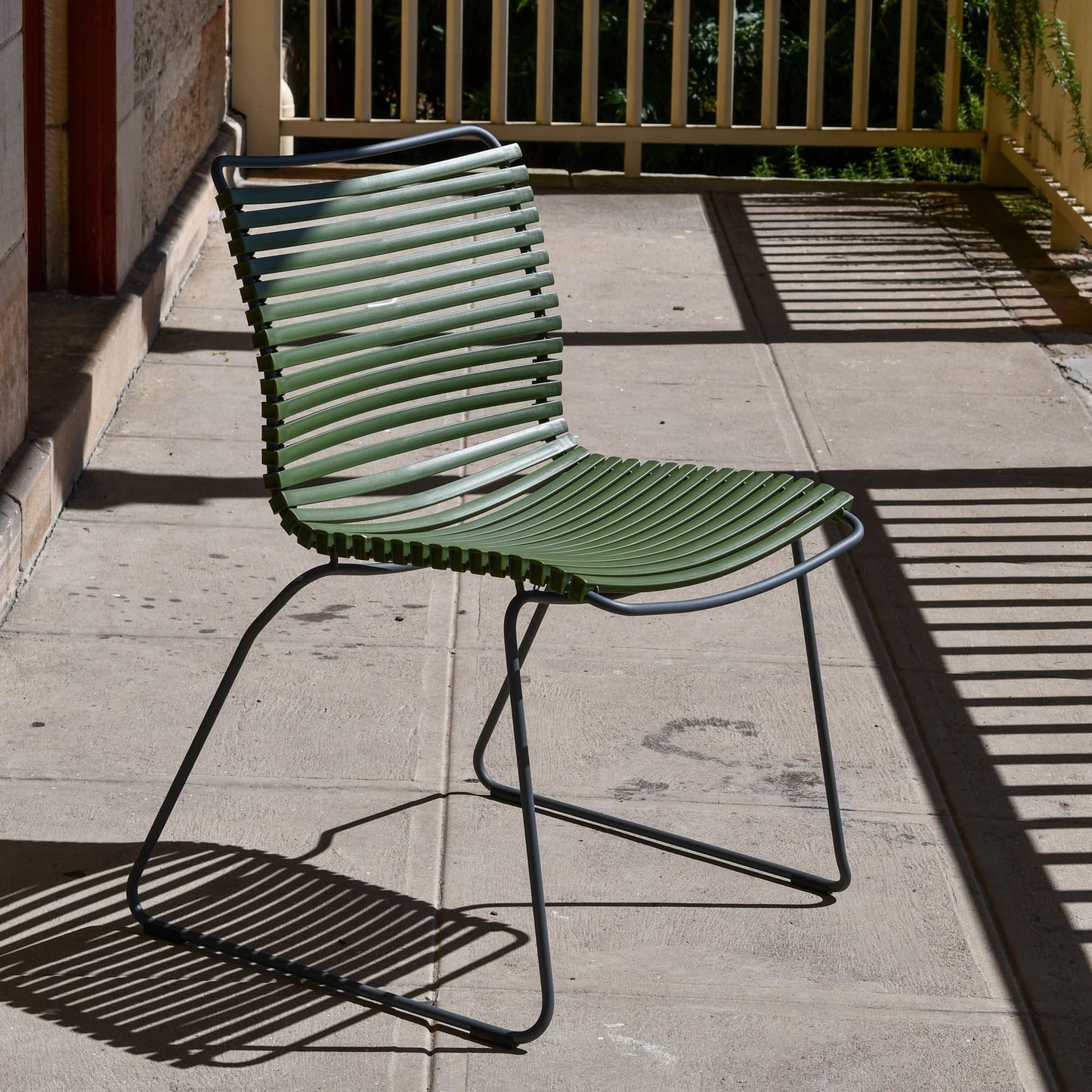 Green outdoor chair on patio