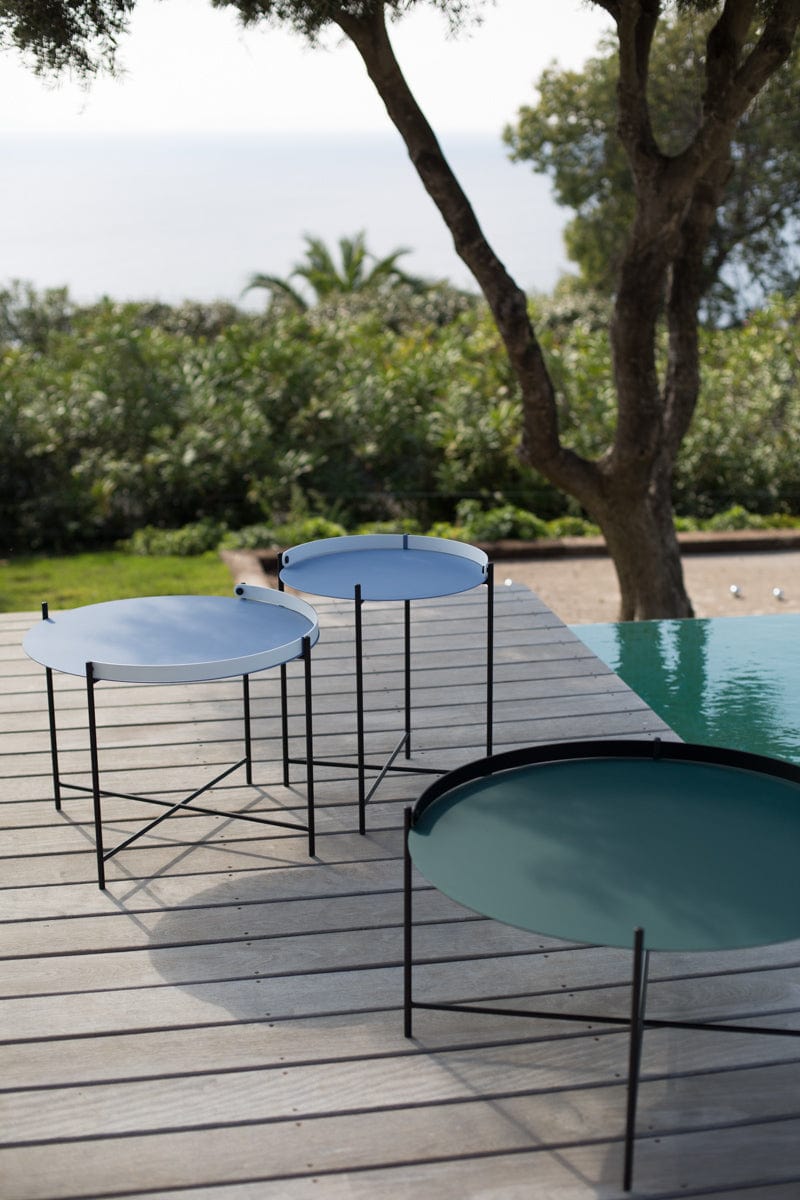 EDGE tables on deck overlooking pool