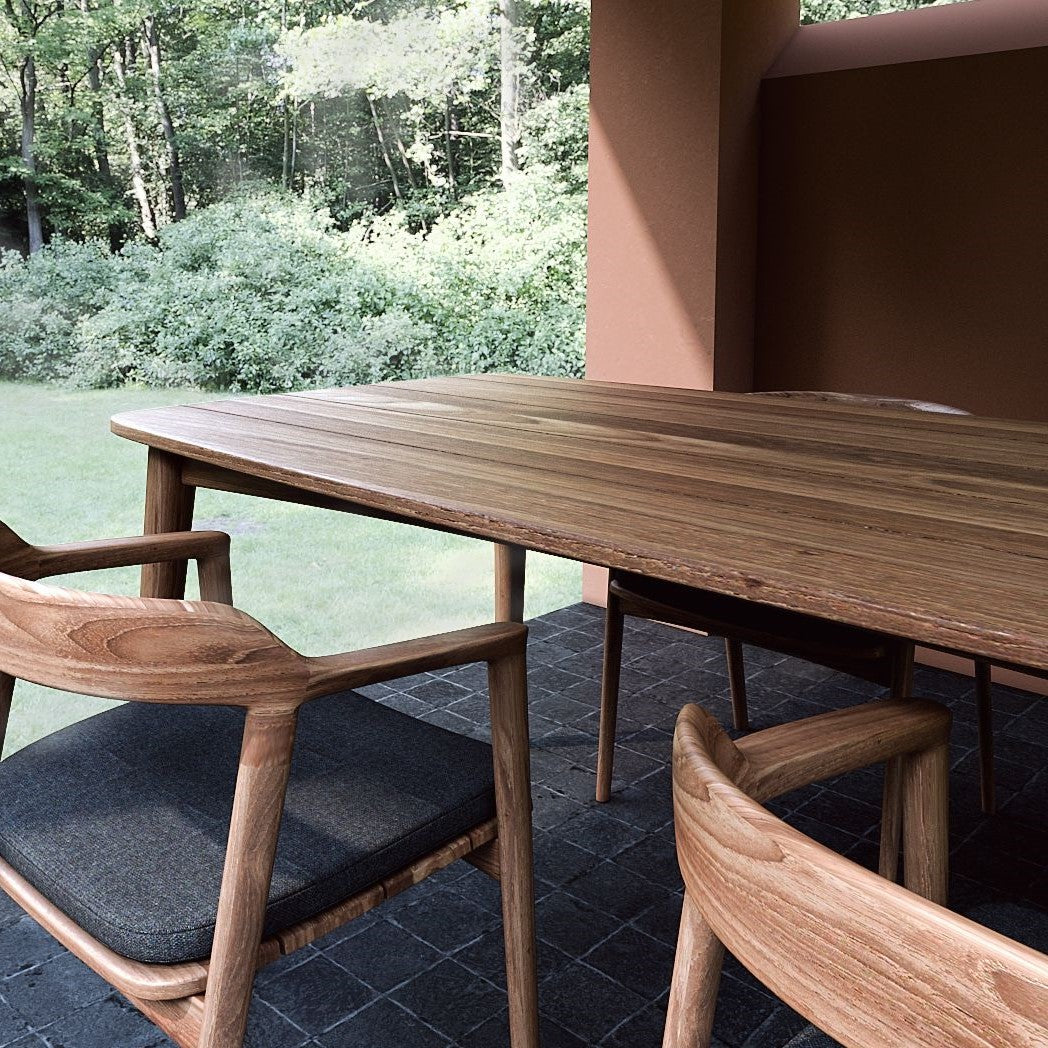 Outdoor dining table and chairs in a natural setting