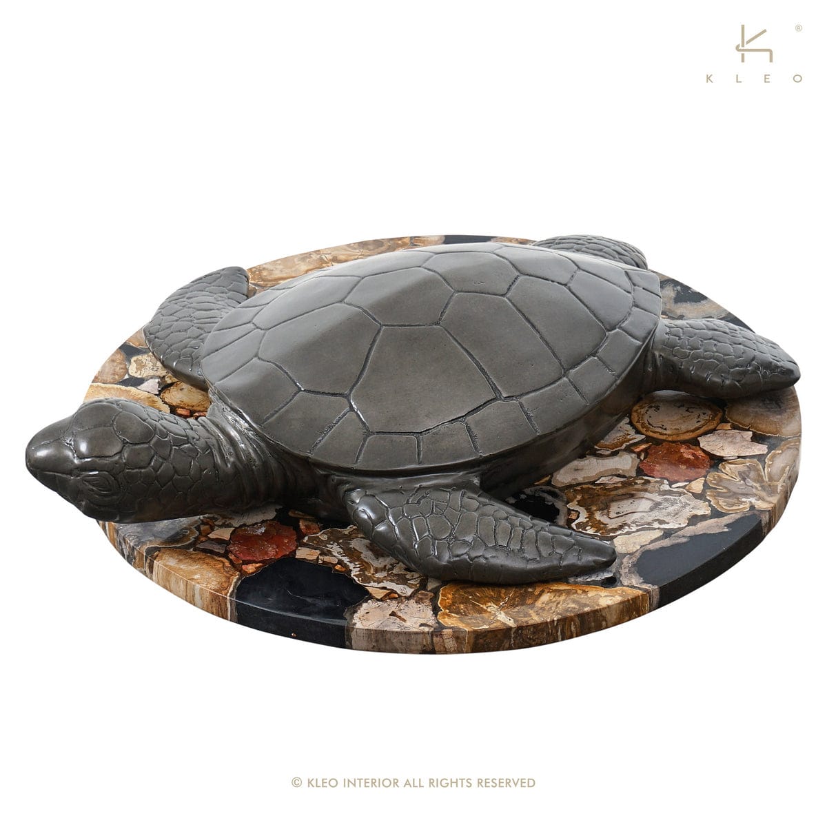Turtle sculpture on stone base