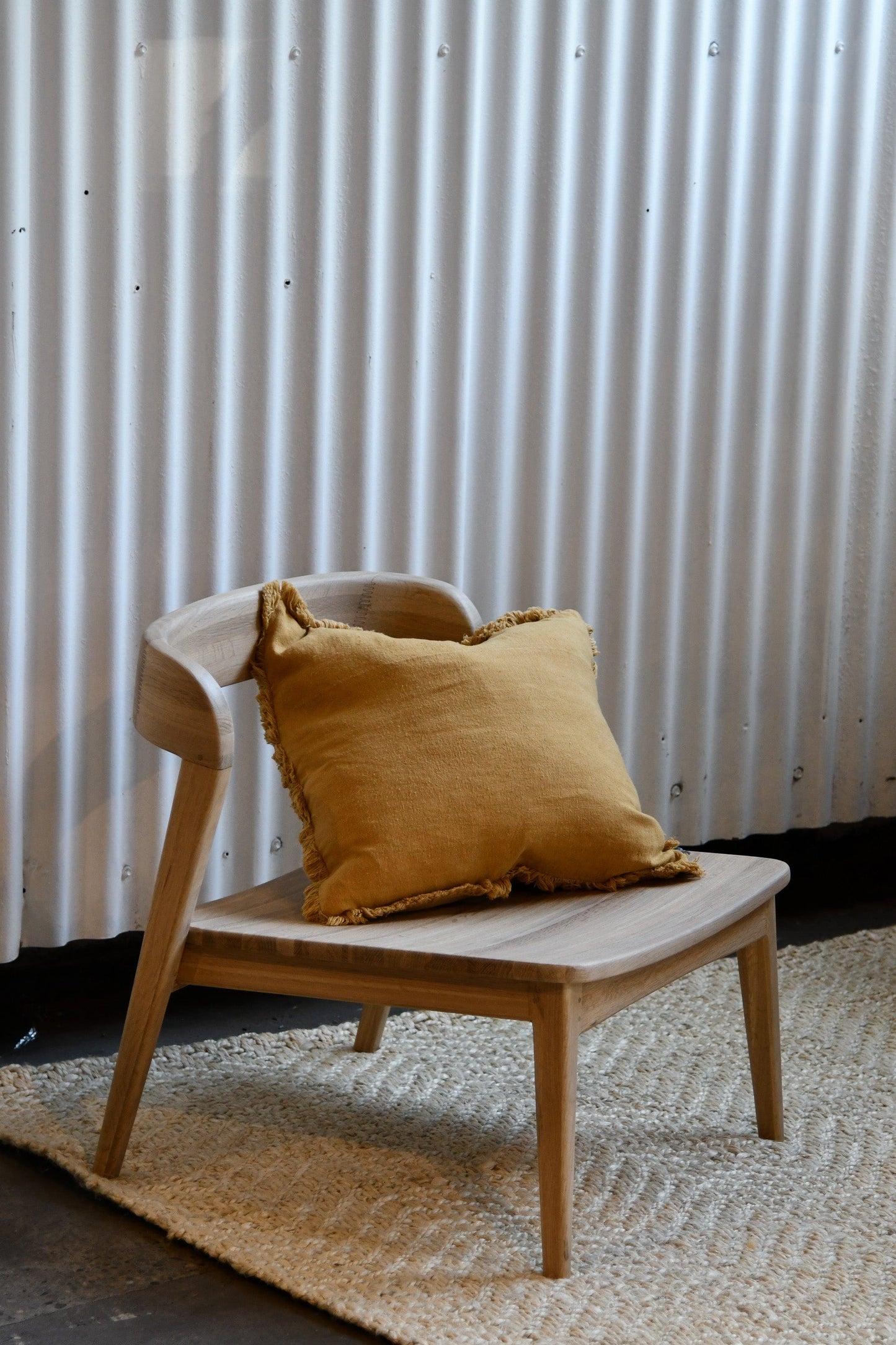 Wooden chair with yellow pillow