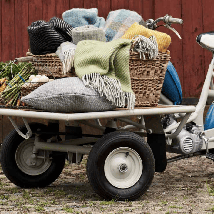 KLIPPAN blankets and pillows on vintage cargo bike