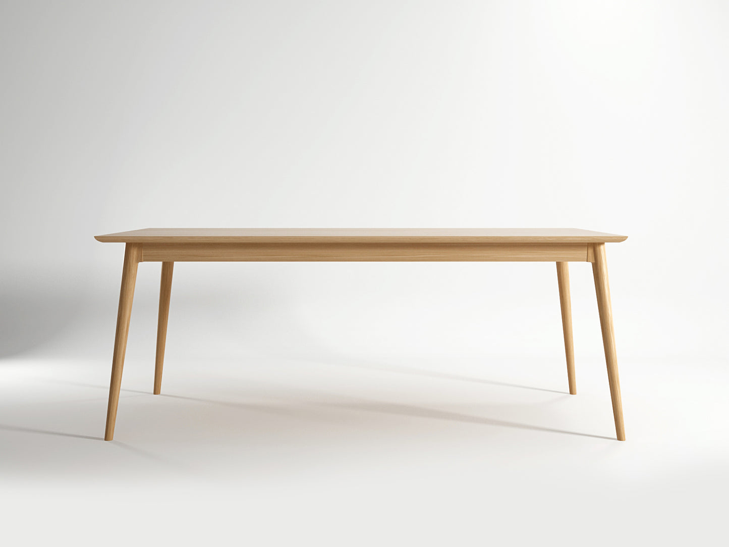 Light wood dining table with tapered legs