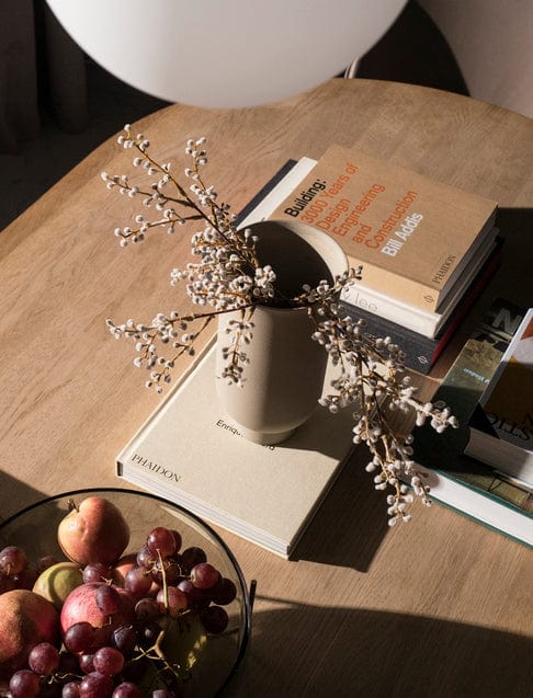 MENU Echasse vase with flowers on books