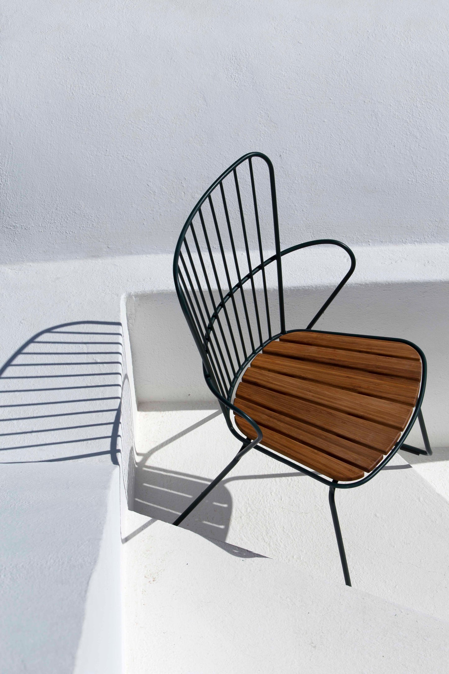 Modern outdoor chair with wooden seat on white background
