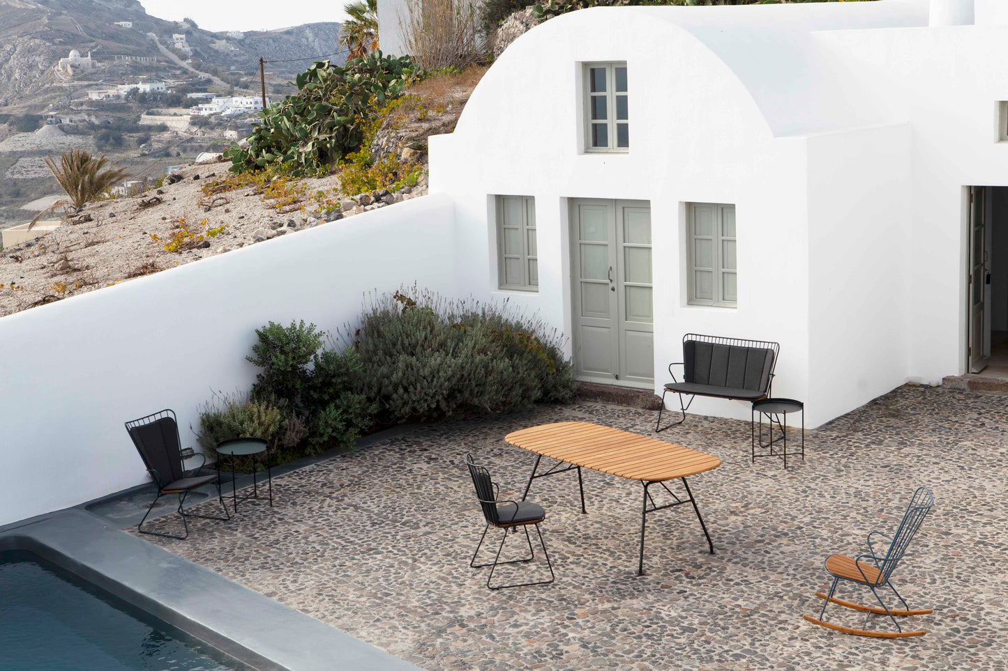Outdoor furniture set in front of white building - MG_1589