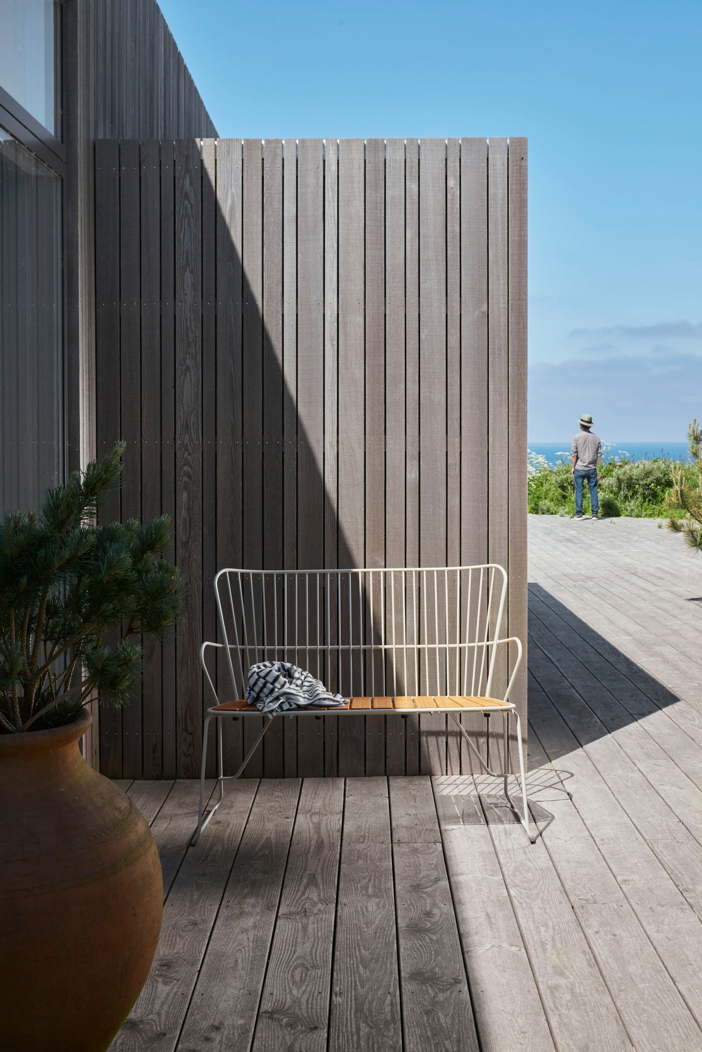 PAON Bench on wooden deck with ocean view