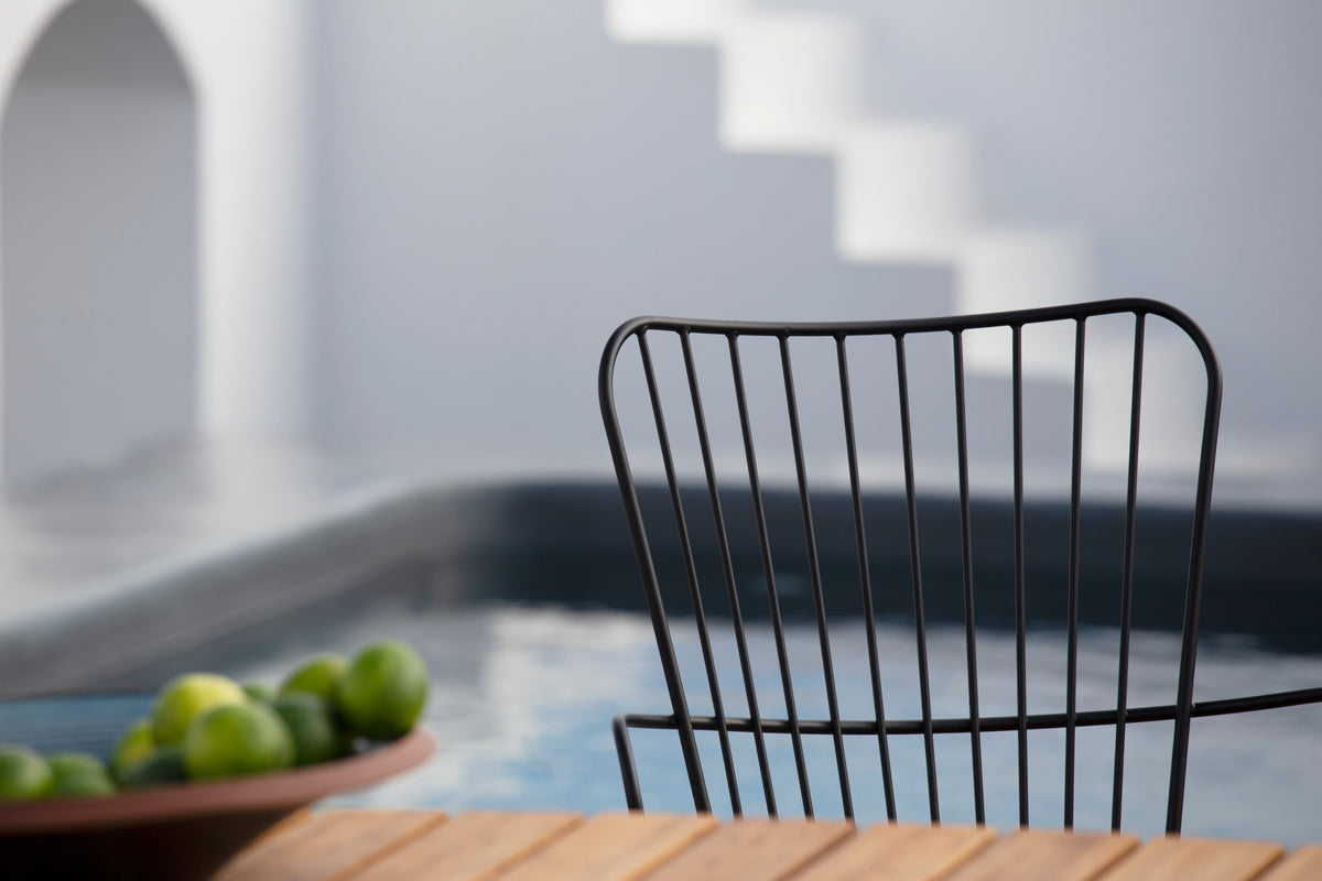 Black chair by pool
