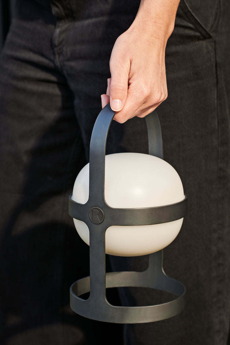 RD26301_7 Portable Lantern held by a person