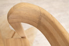 Wooden chair arm detail.