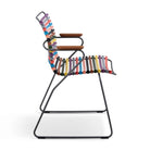 Colorful striped chair with wooden armrests.