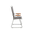 Side view of a black and wood chair.