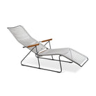 Lounge chair with gray seat and wooden armrests.