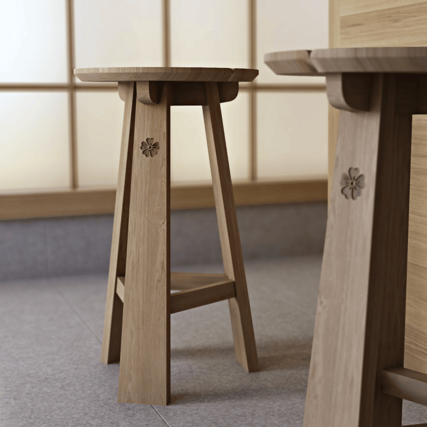 Two wooden stools with carved floral details.