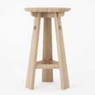 Wooden bar stool with clover details.
