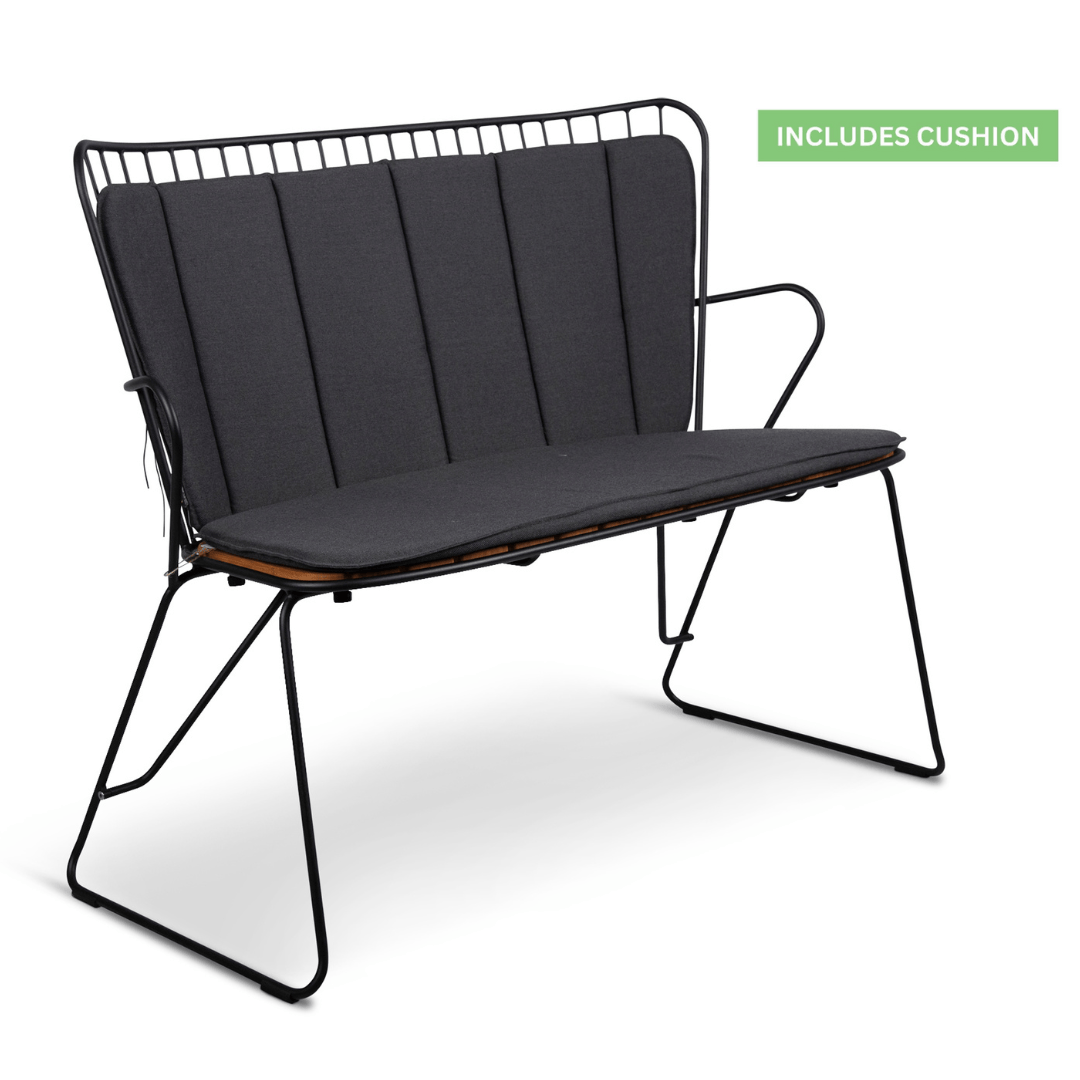 Black metal outdoor bench with gray cushions.