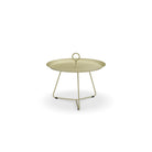 Tan round side table with handle.