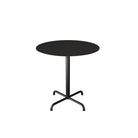 Black round table with a pedestal base.