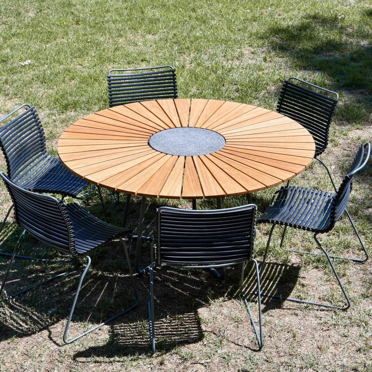 Black 4-seater outdoor dining set with round wooden table