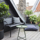 Rooftop patio with black bench and green table, 5065ADUG_2