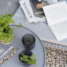 Relaxing outdoor scene with Kinfolk magazine and drinks. 5066AI_6