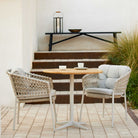 5417ROSA_02 outdoor dining set with woven chairs and round table.