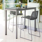 Gray outdoor bar table and stools