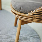54701UT Chair detail with gray cushion and wicker frame