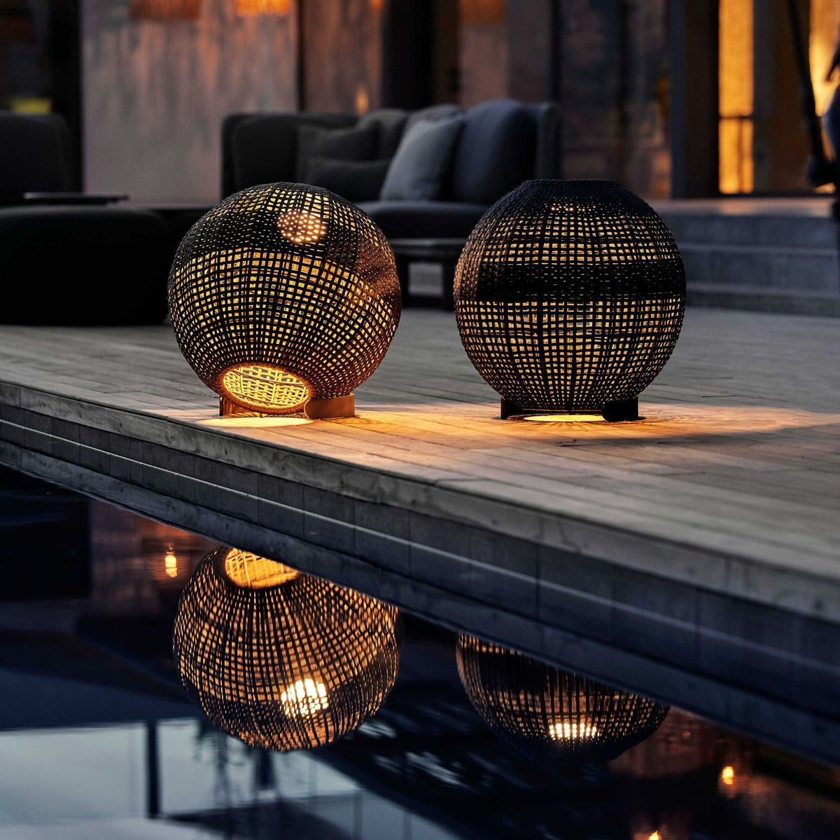 Two 57130ROT outdoor sphere lights reflecting in water.