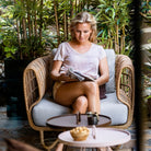 Woman reading in outdoor chair - 57421USL_7