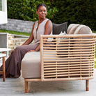 Woman on 7543UAITT_6 rattan sofa