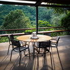 Circle dining table with chairs on outdoor patio