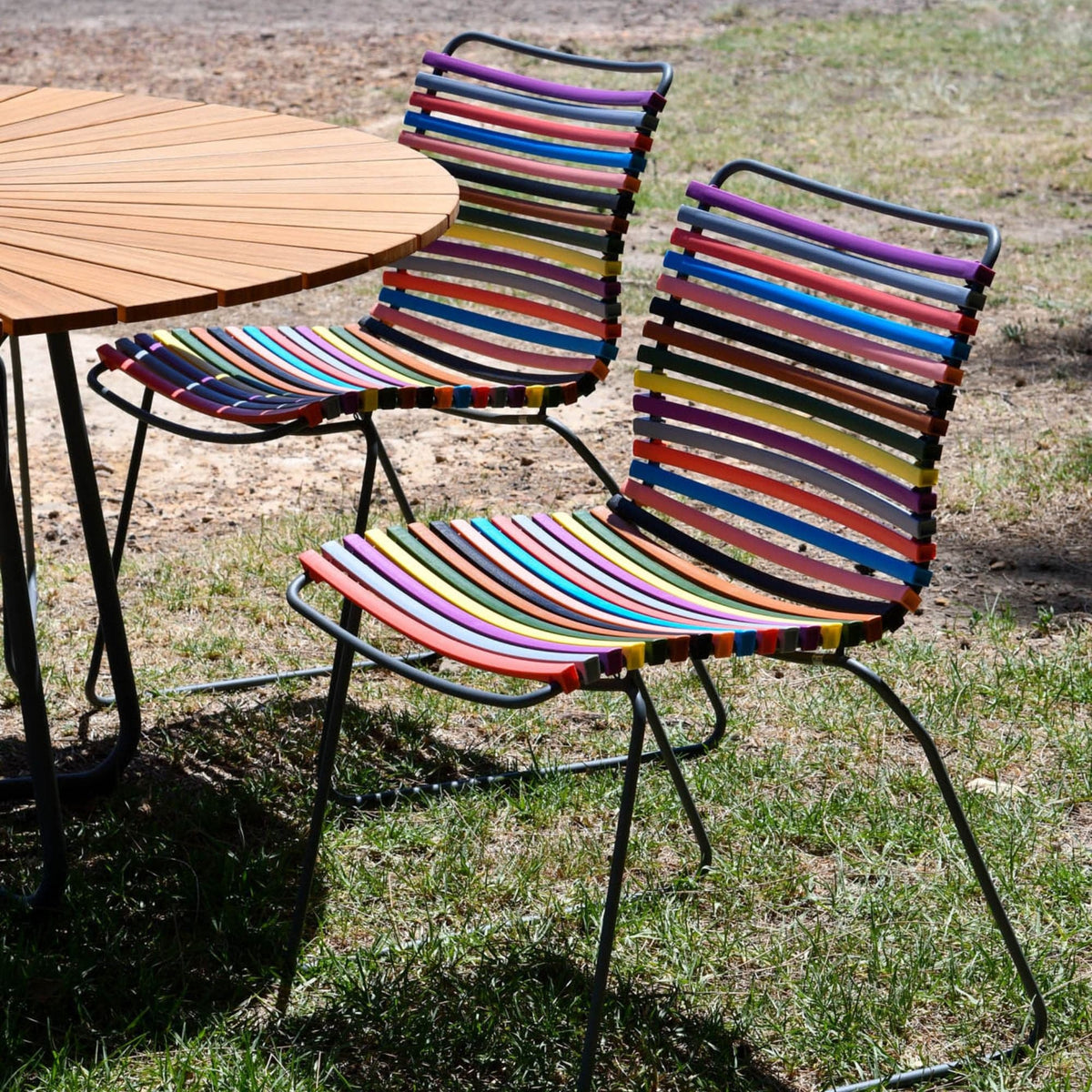 Colorful striped patio chairs with a table