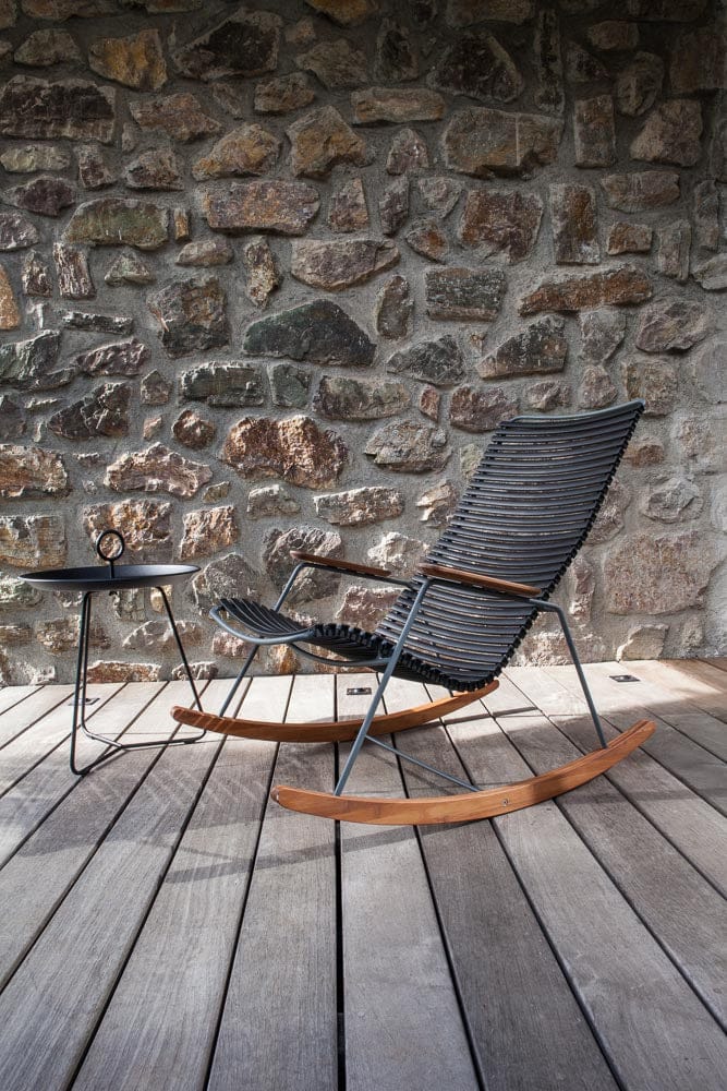 Rocking chair with eyelet detail on wooden deck