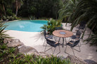 Outdoor dining set by pool