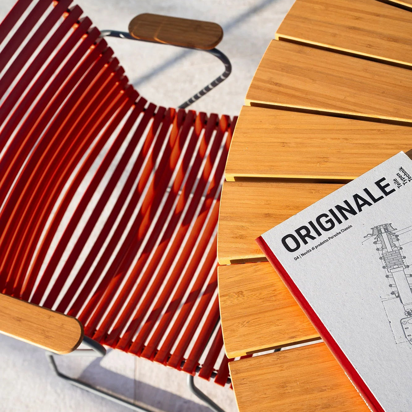 Wooden chair with red seat on a light wooden floor