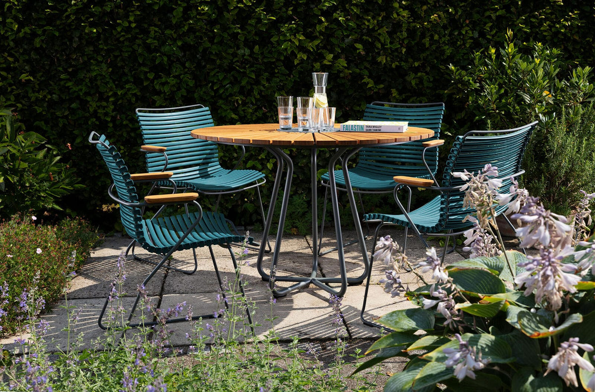 Outdoor dining set with teal chairs and table