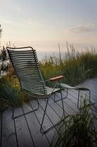 HOUE CLICK Position chair with footrest, olive green, outdoor view.
