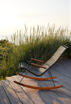 Black HOUE 1971 rocking chair on wooden deck