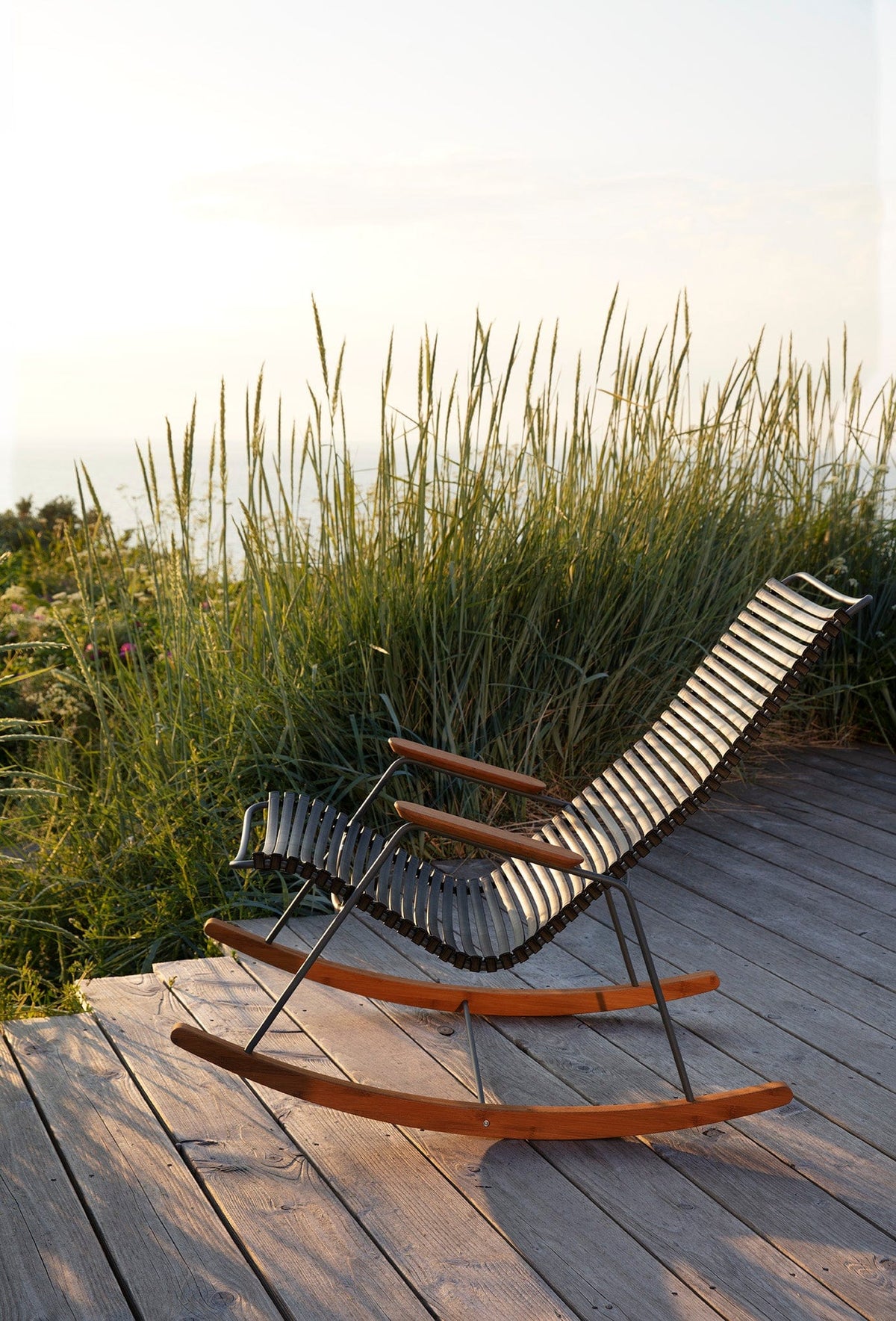 Black HOUE 1971 rocking chair on wooden deck