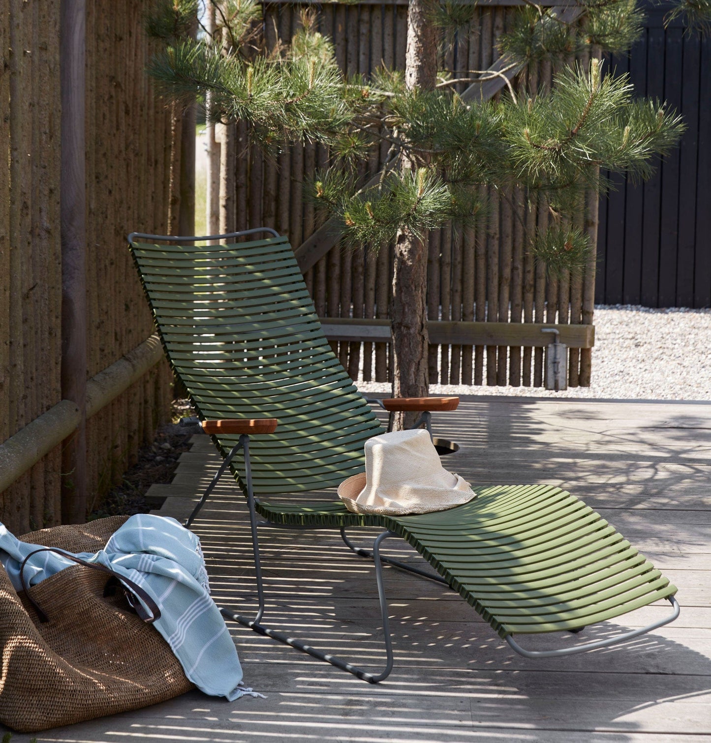 Green CLICK sunlounger on wooden deck
