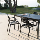 Black dining chairs & table on patio