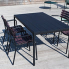 Black dining table with four black dining chairs