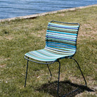 Blue striped chair by water