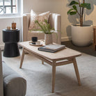 Living room with armchair, coffee table, and artwork - DSC_1513