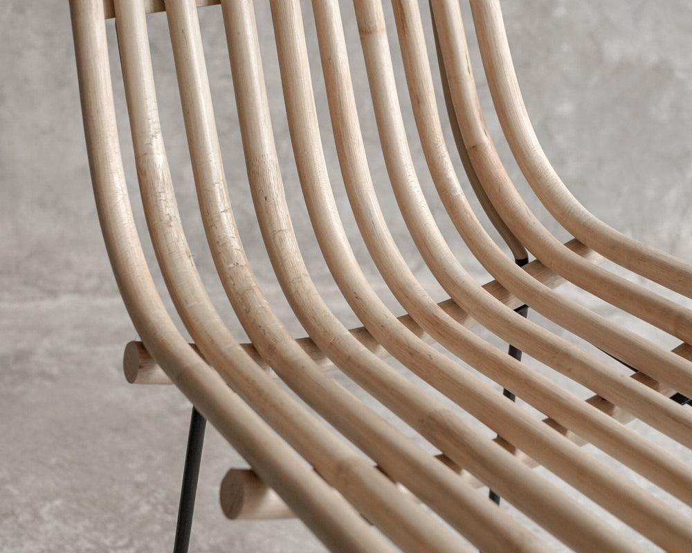 Close-up of curved wooden chair back