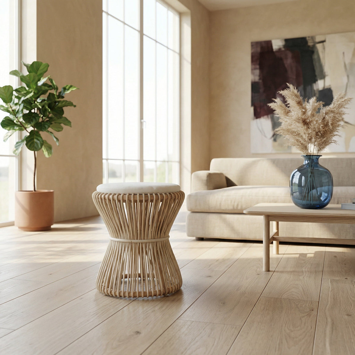 Modern living room with a wicker stool, plant, and sofa.