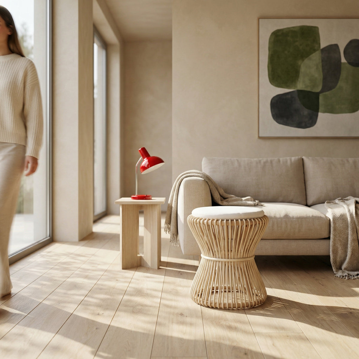 Modern living room with beige sofa, red lamp, and abstract art on wall